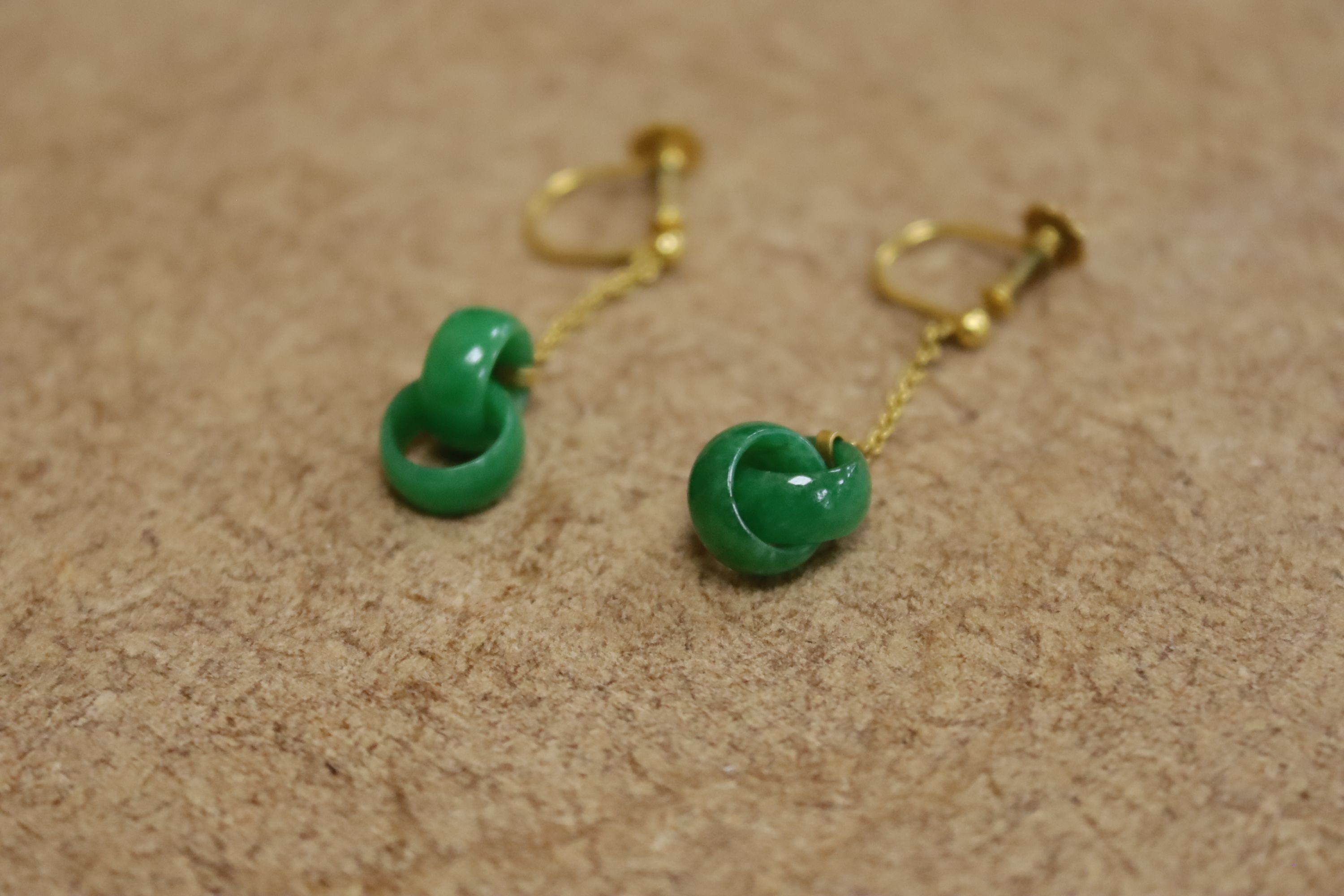 A pair of early to mid 20th century 9c yellow metal and jade double loop drop ear clips, drop 27mm, gross weight 1.8 grams.